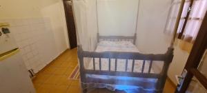 a small room with a bed in a room at Studio pour 2 personnes au calme en Basse-Terre in Vieux-Habitants