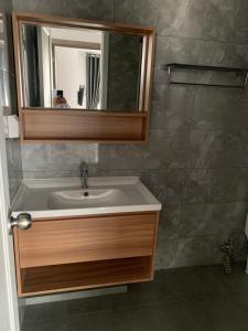 a bathroom with a sink and a mirror at B70 HC Rental Apartment at TK Central with Swimming Pool & Gyms in Phnom Penh