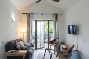 a living room with a couch and a table at Casita Montecastillo K4 - 2 bedrooms in Caleta De Fuste