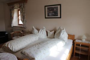 a bedroom with two beds with pillows on them at Haus Schönegger in Kitzeck im Sausal