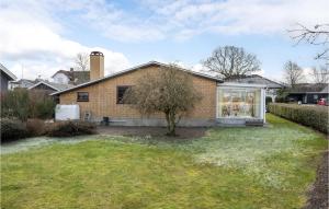 a brick house with a window and a yard at 3 Bedroom Beautiful Home In Haderslev in Haderslev