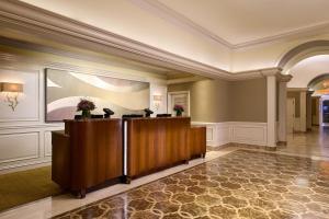 a lobby with a reception desk in a building at The St. Regis Houston in Houston