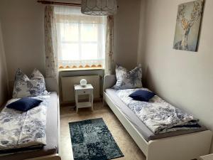 Postel nebo postele na pokoji v ubytování Ferienwohnung Fernblick Breitenberg