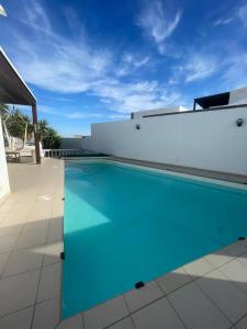 a swimming pool on the roof of a house at Lemon tree in Tías