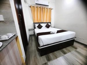 Postel nebo postele na pokoji v ubytování SM Rooms HSR Layout Bengaluru