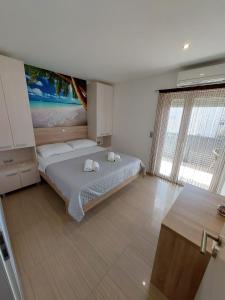 En eller flere senger på et rom på Apartmani Tropical