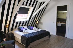 Postel nebo postele na pokoji v ubytování Hotel Zeezicht