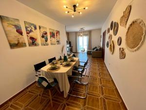 a dining room with a table and chairs at Villa Rangel in Olivenza