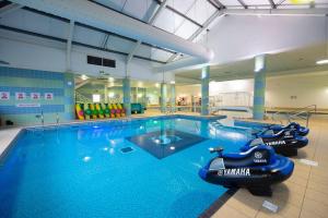 a large swimming pool with an inflatableride in a gym at Sunrise 132 in Winthorpe