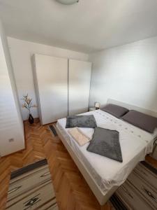 a bedroom with a large bed in a room at Apartment Ivanka in Senj