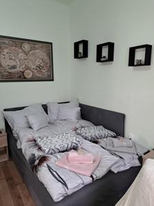 Postel nebo postele na pokoji v ubytování Manilla Vendégháza