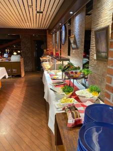 a buffet line with plates of food in a restaurant at Hotel Lapuahovi in Lapua