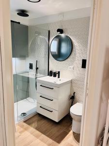 a bathroom with a sink and a toilet and a shower at Fiori d'Arancio in Terrasini