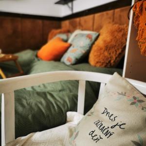 a white chair with a pillow with the words drugs are autism at Perníková chalúpka in Bojnice