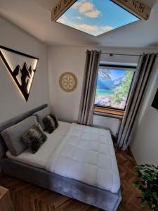 Posteľ alebo postele v izbe v ubytovaní Apartament z jacuzzi Zakopane