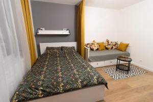 Uma cama ou camas num quarto em Harmony apartman