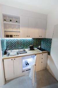 A cozinha ou kitchenette de Harmony apartman