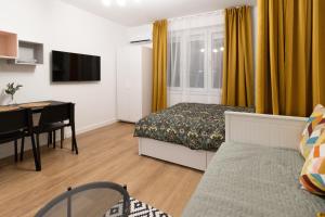 Uma televisão e/ou sistema de entretenimento em Harmony apartman