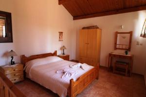 سرير أو أسرّة في غرفة في Villa Amalia