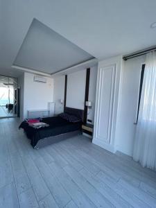 a bedroom with a bed in the middle of a room at Luxury Triplex Villa in Trabzon