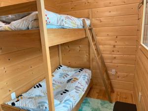 a bunk bed room with two bunk beds in a cabin at Polar House Karuisawa - Vacation STAY 30319v in Kutsukake