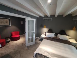 Posteľ alebo postele v izbe v ubytovaní XII Century Heritage Hotel