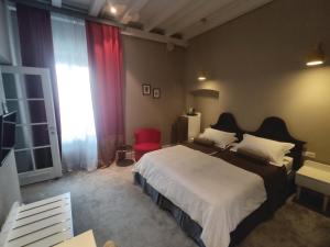 Posteľ alebo postele v izbe v ubytovaní XII Century Heritage Hotel