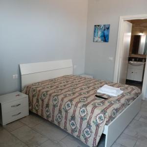 A bed or beds in a room at Affittacamere Sole e Luna