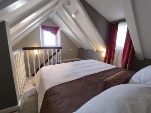 Posteľ alebo postele v izbe v ubytovaní XII Century Heritage Hotel