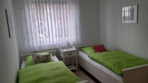 Postel nebo postele na pokoji v ubytování Juist - Freund, FeWo Inselresidenz Wattenmeer Wo3