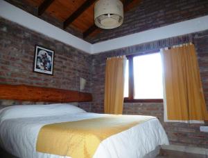 Säng eller sängar i ett rum på Balcones de Puelo