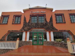 The facade or entrance of Castillo Mar- Casa Martini
