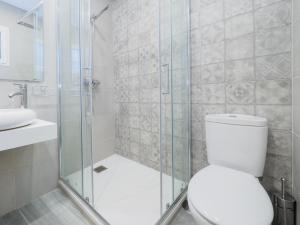 a bathroom with a shower and a toilet and a sink at Apartment on Beach Mijas 2 in Sitio de Calahonda