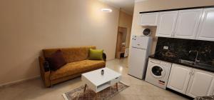 a living room with a couch and a table at Wonderful City Center 1 in Durrës