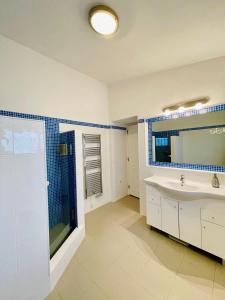 a bathroom with a sink and a shower at Villa Serro das Vinhas in Portimão