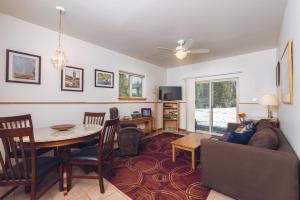 a living room with a couch and a table at Apartment Dolphin House in Haines