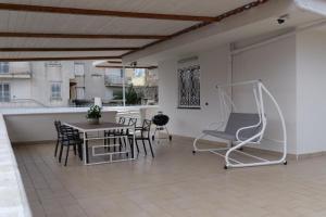 a room with a table and chairs and a table and chairs at Villa Salvius Pompei in Pompei