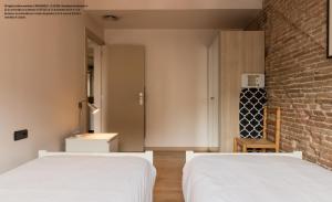 Postel nebo postele na pokoji v ubytování Barnapartments Raval
