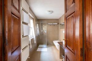 a bathroom with a shower and a sink and a toilet at La finestra sulle Langhe - m3langhe in Cherasco