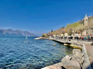 a view of a body of water with mountains in the background at Cà Irene - Cà Battistoni in Brenzone sul Garda