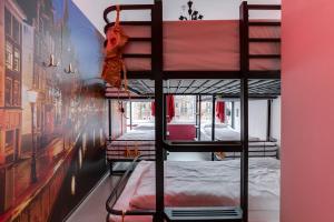 a couple of bunk beds in a room at Cocomama in Amsterdam