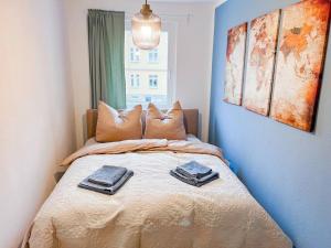 Postel nebo postele na pokoji v ubytování Ferienwohnung 4 Personen *Parkplatz, WLAN, Waschmaschine*