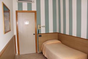 Postel nebo postele na pokoji v ubytování Hotel Milano