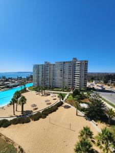 an aerial view of a resort with a beach at Departamento Laguna Vista Marina in Algarrobo