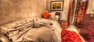 Postel nebo postele na pokoji v ubytování Riad Arabic House & Spa