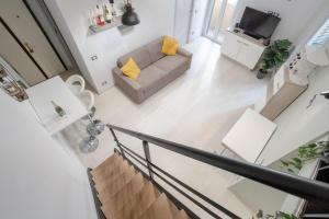 A television and/or entertainment centre at Green House Morin - San Pietro