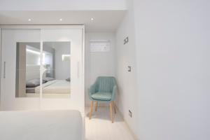 A bed or beds in a room at Green House Morin - San Pietro