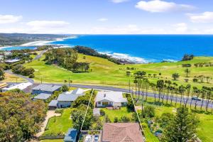 an aerial view of a house and the ocean at 12 Bluewater Drive Narooma in Narooma