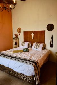 מיטה או מיטות בחדר ב-Casa Yuk’