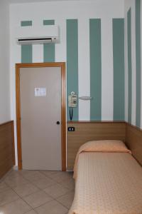 Postel nebo postele na pokoji v ubytování Hotel Milano